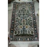 A modern Persian hand knotted rug with cream ground