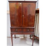 A Regency style drinks cabinet with 2 doors and 2 drawers
