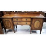 A Georgian style mahogany sideboard by Waring & Gillows, with 2 cupboards and 2 central drawers