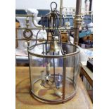 An early to mid-20th Century circular brass and glass hanging hall light