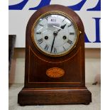 An Edwardian inlaid mahogany mantel clock with arch top and strike
