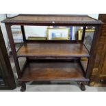 A mahogany gadrooned 3 tier dumb waiter on ball and claw feet