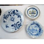 An 18th century Delft large blue & white circular dish (cracked and border fritted); a similar