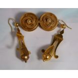 A pair of filigree pendant earrings with oval drops; a filigree double circle brooch (no pin),