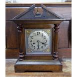 A 1920's mahogany case chiming mantel clock