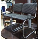 A set of 6 designer dining chairs in tubular chrome, the seats and backs upholstered in grey trellis