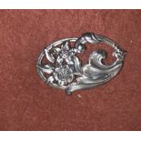 A sterling oval openwork brooch, Norseland by Coro, with repousse floral design, 6.5 cm