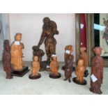 An early / mid 20th century Chinese carved wood group of a mother and child and a selection of other