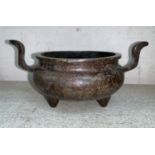 A 19th century Chinese bronze censer with 2 handles and character mark to base, diameter 7.5"