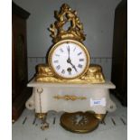 A 19th century mantel clock in gilt metal and alabaster, white enamel dial and French timepiece