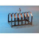 An arched toast rack with 6 divisions, Birmingham 1923, 5 oz