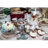 A Royal Albert Country Roses tea pot and six cups and saucers, a Queen Anne part service and two