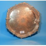 A silver circular salver with beaded shell and acanthus border and chased floral decoration, 3