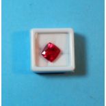 A loose cushion cut natural ruby, 10.95 carat, with GGL certificate (enhanced)
