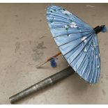 An oriental hand painted parasol in original metal case