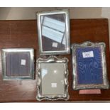 A silver Victorian style photo frame; 3 silver plated photo frames