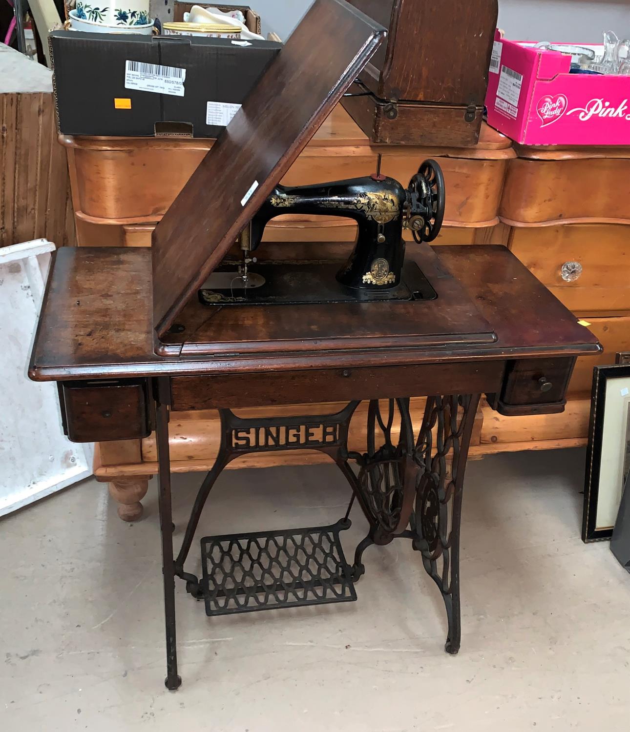 A Singer treadle sewing machine in mahogany case