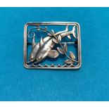 A Danish sterling silver brooch designed by Arno Malinowski for Georg Jensen, with two leaping