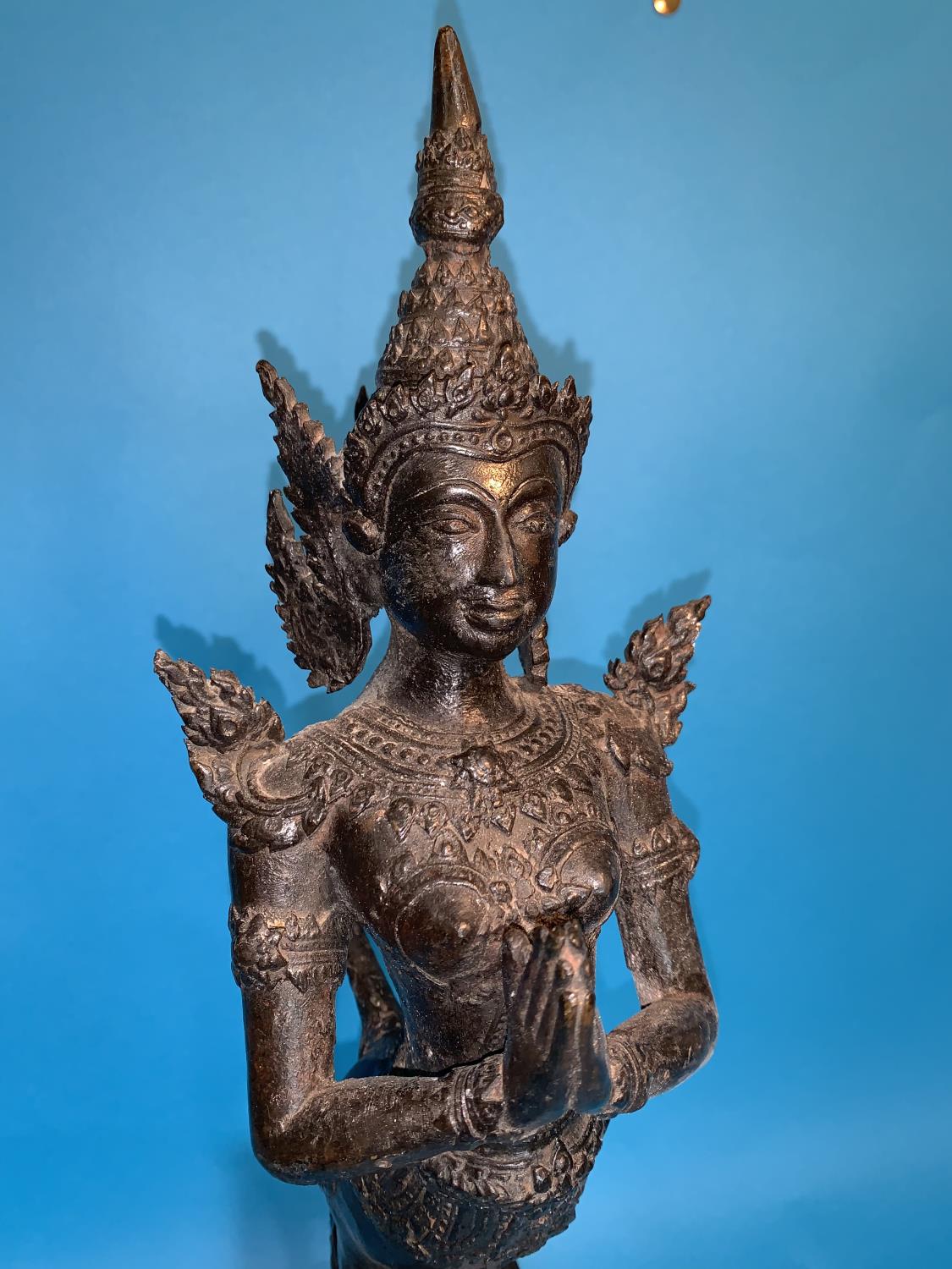 A Thai bronze figure of a goddess with hands folded in prayer and long tail on wooden plinth, height - Image 2 of 4