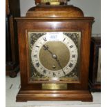 A reproduction walnut cased presentation mantel clock