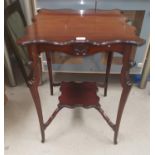 A mahogany two tier shaped occasional table