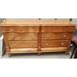 A 19th century stripped pine chest of 6 drawers with moulded glass handles, serpentine front, on