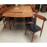 A 1960's Danish teak dining suite comprising large rounded rectangular table with 3 spare leaves,