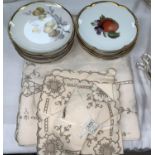 Two Bavarian sets of 6 pottery dessert plates; a Madera table cloth and napkins