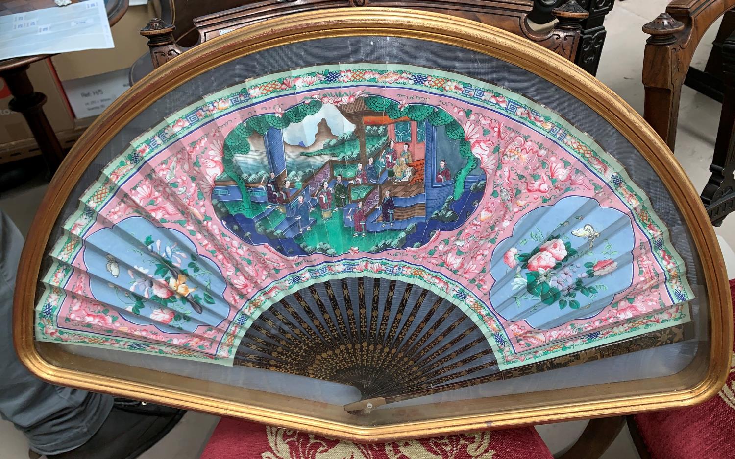 A 19th century Chinese Canton fan hand painted with traditional scenes and flowers in gilt and