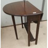 An early 20th century mahogany drop leaf occasional table
