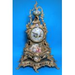 A 20th century mantel clock in gilt metal and porcelain mounted rococo style case, circular dial and