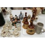 A selection of Wade whisky decanters; other spirit containers; a selection of toby jugs; crested