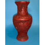 A 19th century Chinese cinabar lacquer baluster vase with relief decoration (lacquer chip to rim and