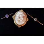 A bar brooch set with aquamarine coloured stone, stamped 9c, a white metal bar brooch set amethyst