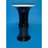A Chinese black and white glazed Gu vase with blue concentric circles to base height 5"