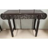 A late 19th / early 20th century Chinese hardwood altar table with rounded ends, extensively
