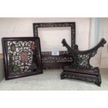 Two Chinese carved table screen frames and a carved wood Chinese panel