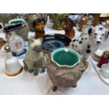 An Art Pottery cat, signed 'P F Alexander'; a similar dog; a pair of lion money boxes; a large