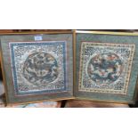 A pair of embroidered silk Chinese panels depicting dragons