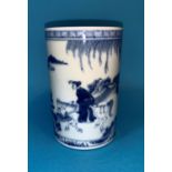 A cylindrical Chinese blue and white brush pot finely painted with figure on horse back in