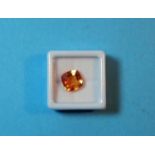 A loose cushion cut natural orange sapphire, 7.45 carats, with GGL certificate (enhanced)(9.8 x 9.