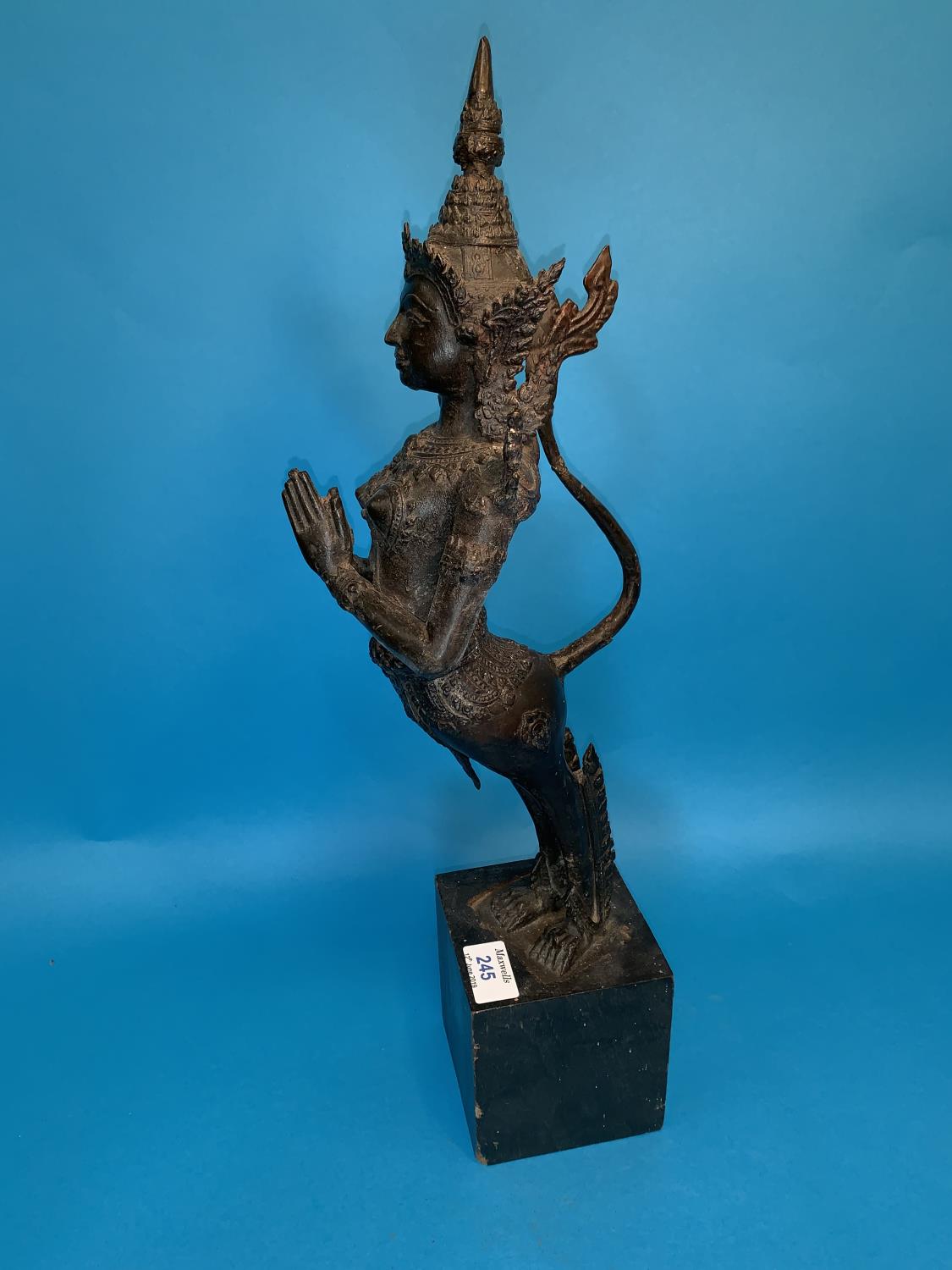A Thai bronze figure of a goddess with hands folded in prayer and long tail on wooden plinth, height - Image 3 of 4