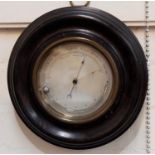 A 19th century aneroid barometer with silvered dial and curved thermometer, ebonsed case, 9"