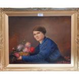 V Denayer: Seated lady holding a bowl of flowers, oil on canvas, signed and dated 1918, inscribed "