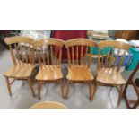 Four pine stick back dining chairs