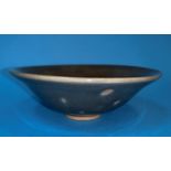 A Chinese flared stone ware bowl under thick dark green glaze diameter 5.5"