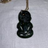 A Maori Tiki pendant in jade coloured hardstone