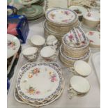 A Royal Crown Derby dinner and tea service with polychrome bouquets of flowers and intertwined