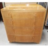 A 1960's light oak bow front chest of 4 drawers