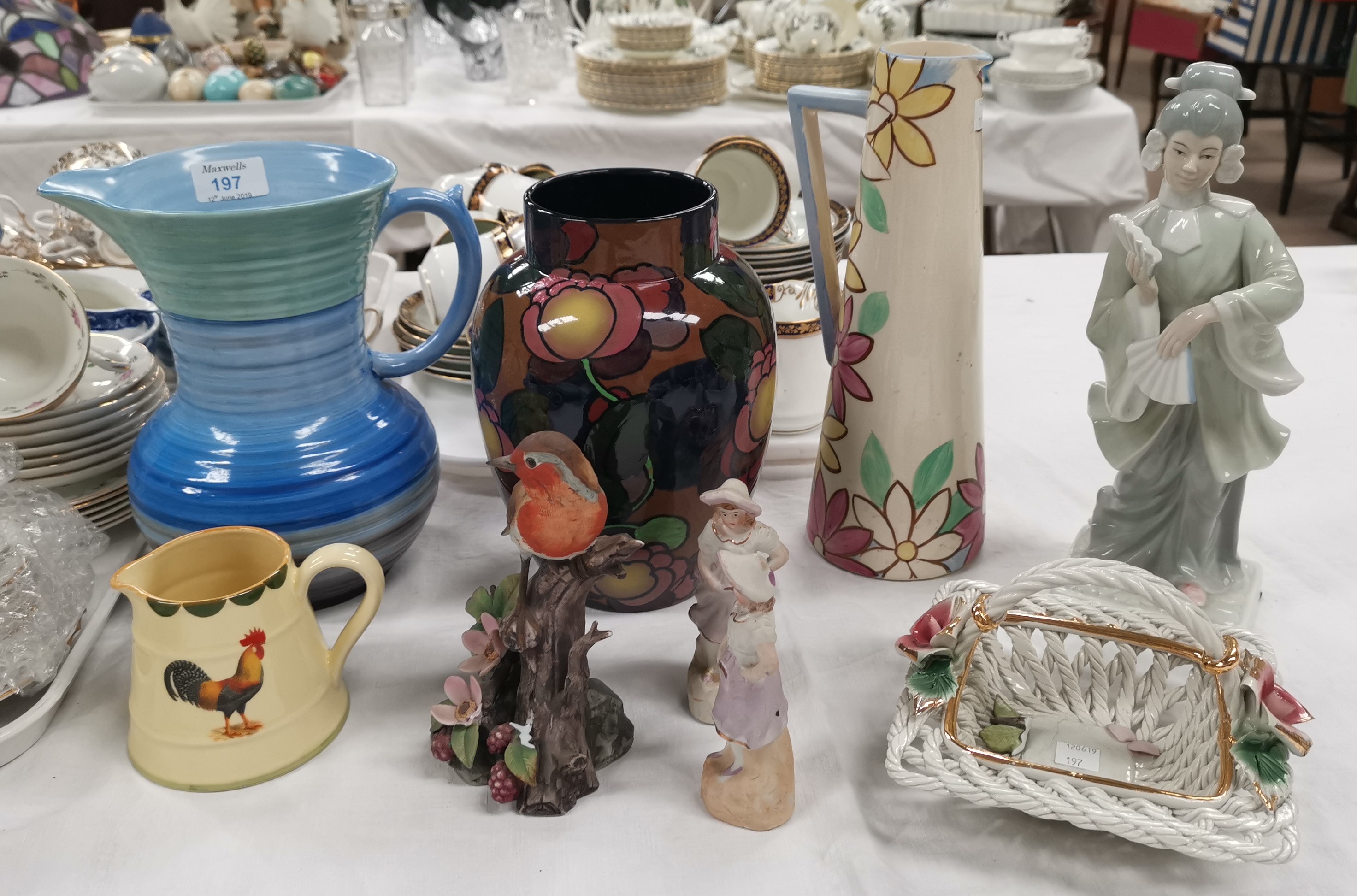 A 1930's Shelley blue dripware vase; a Royal Stanley baluster vase; a cockerell jug' Lladro style